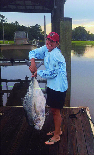 Image of woman holding African pompano