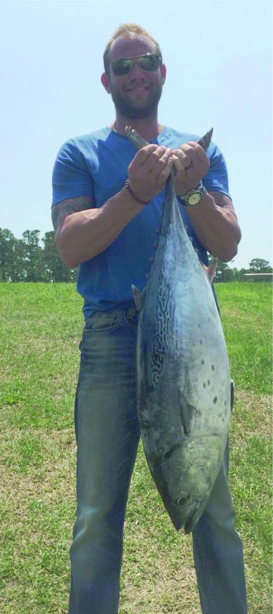 Image of man holding little tunny