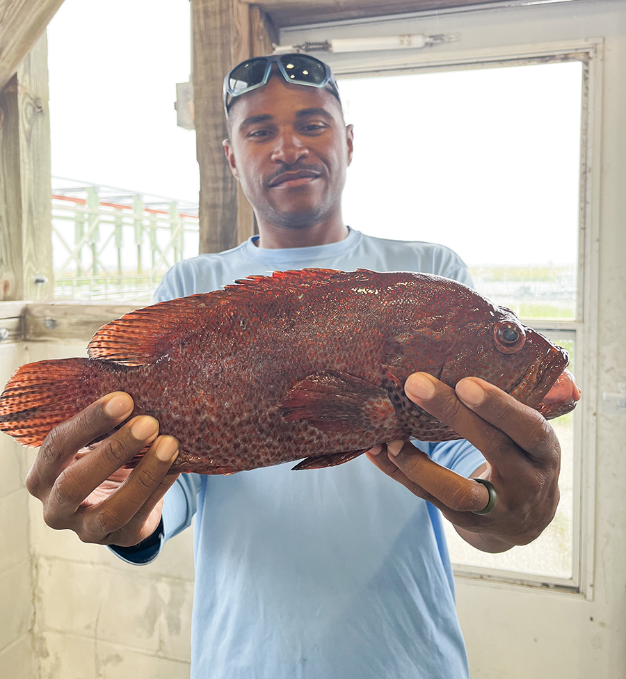 Justin Bythwood with graysby grouper. DNR photo by Tyler Jones.