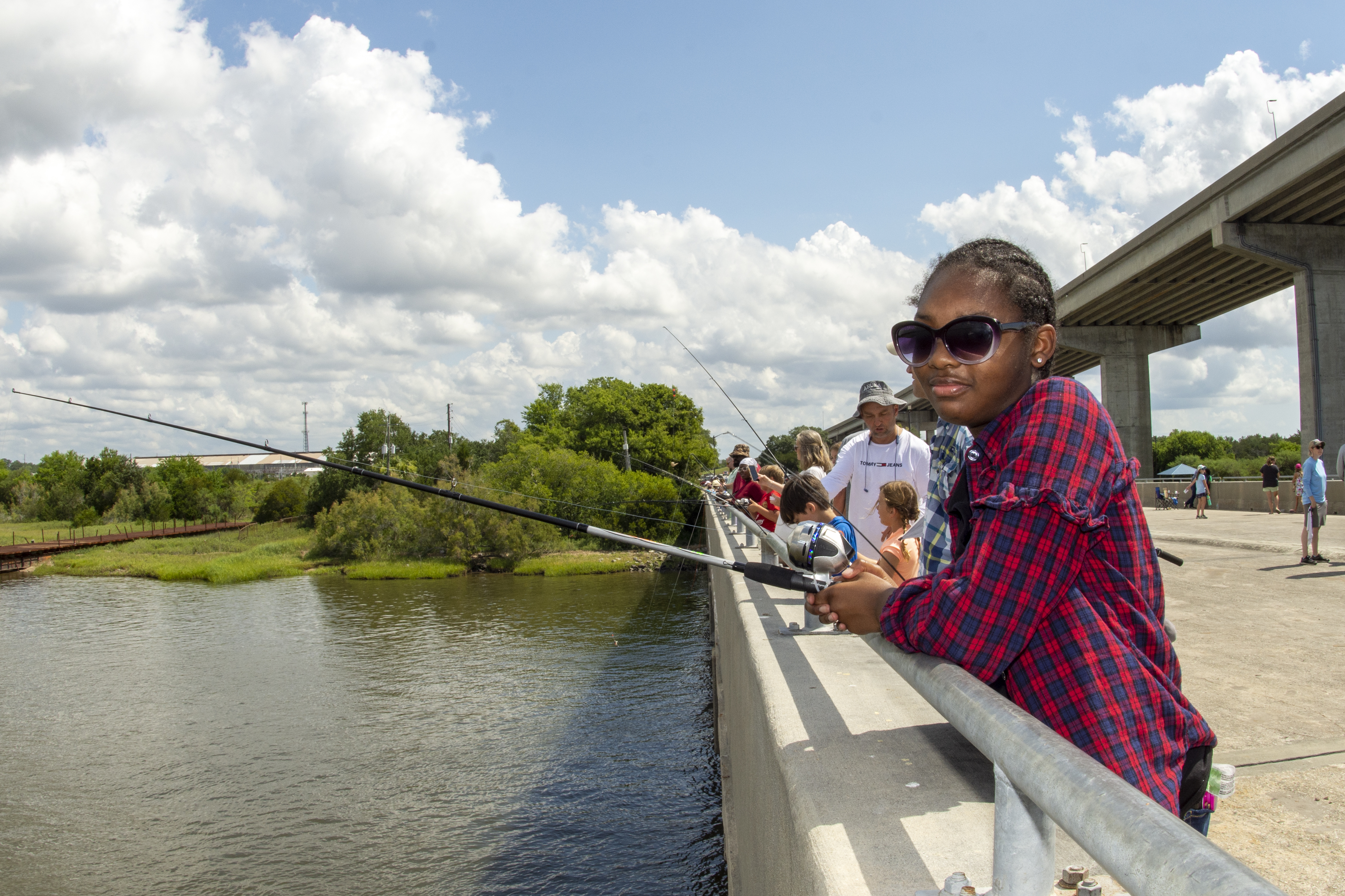 People fishing from pier