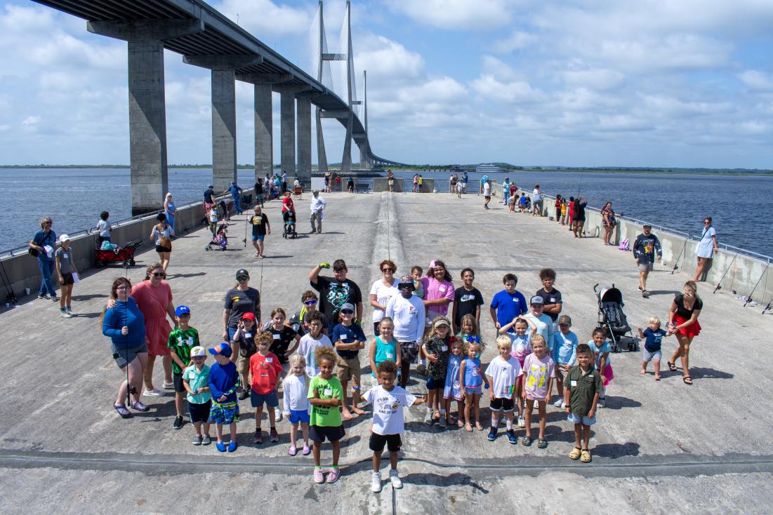 A wide shot of the Kids Fishing Event Participants. Photo by Tyler Jones/CRD A wide shot of the Kids Fishing Event Participants. Photo by Tyler Jones/CRD