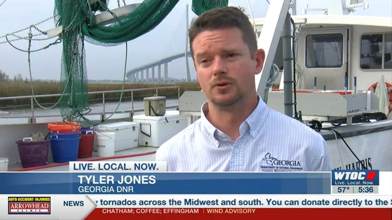 Tyler Jones, a public information officer with CRD, conducts an interview with Savannah’s WTOC-TV about the opening of shrimp season in 2023 on the docks at DNR’s Coastal Regional Headquarters Tyler Jones, a public information officer with CRD, conducts an interview with Savannah’s WTOC-TV about the opening of shrimp season in 2023 on the docks at DNR’s Coastal Regional Headquarters