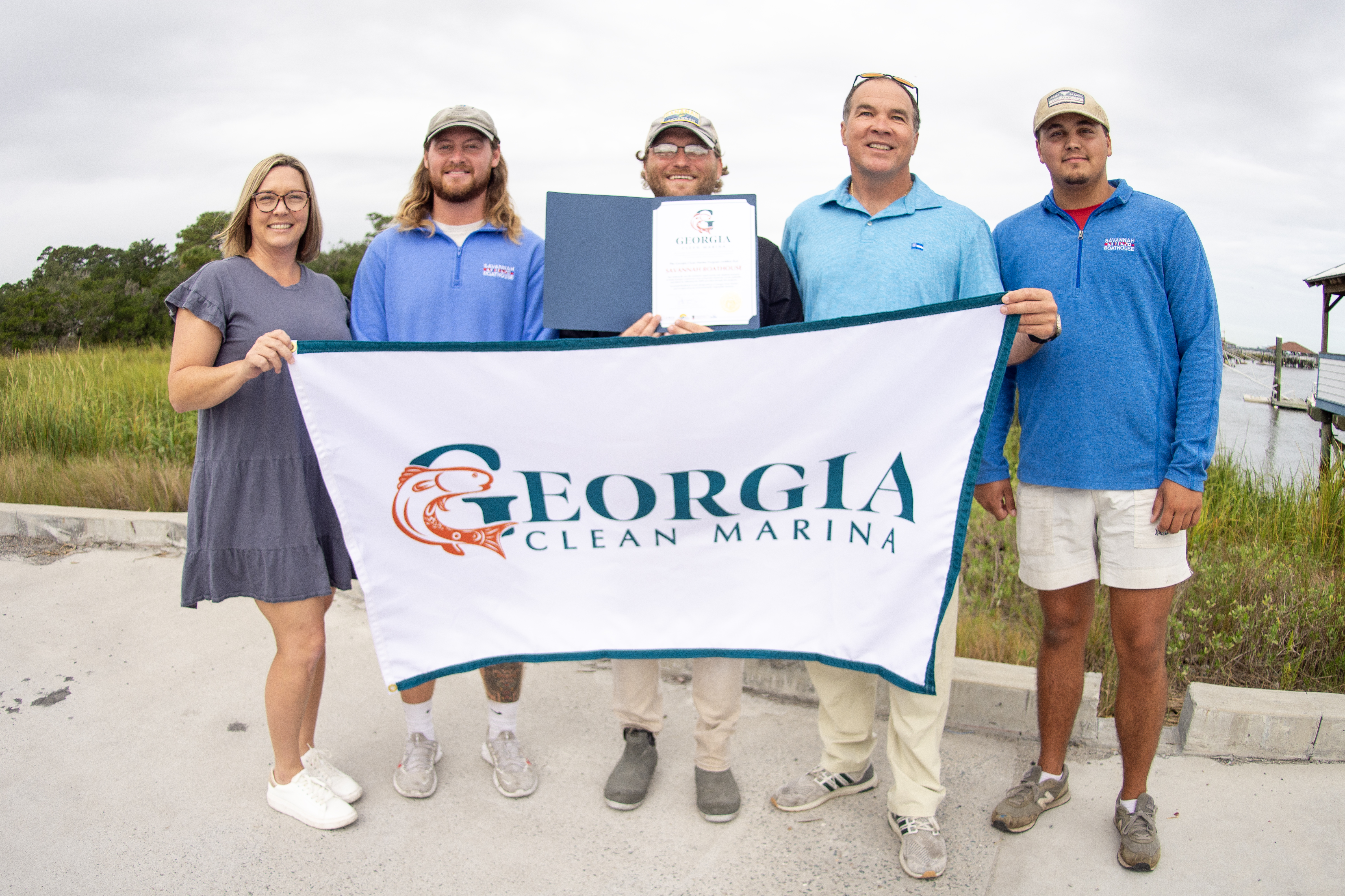 The staff of Savannah Boathouse Marina pose for a photo.